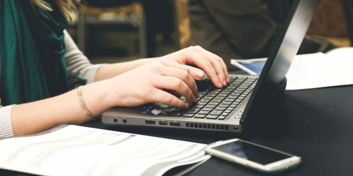 woman typing on laptop